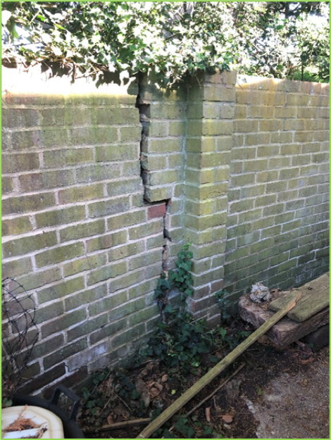 Crack in brick fence